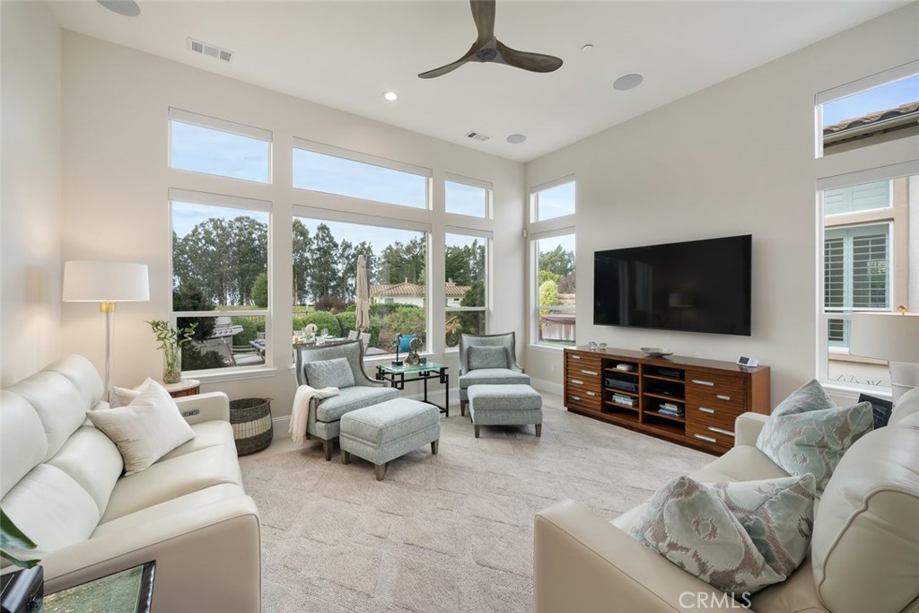 1988 Eucalyptus Road Nipomo, CA 93444 - Photo 16 of 63 a living room with furniture and a flat screen tv