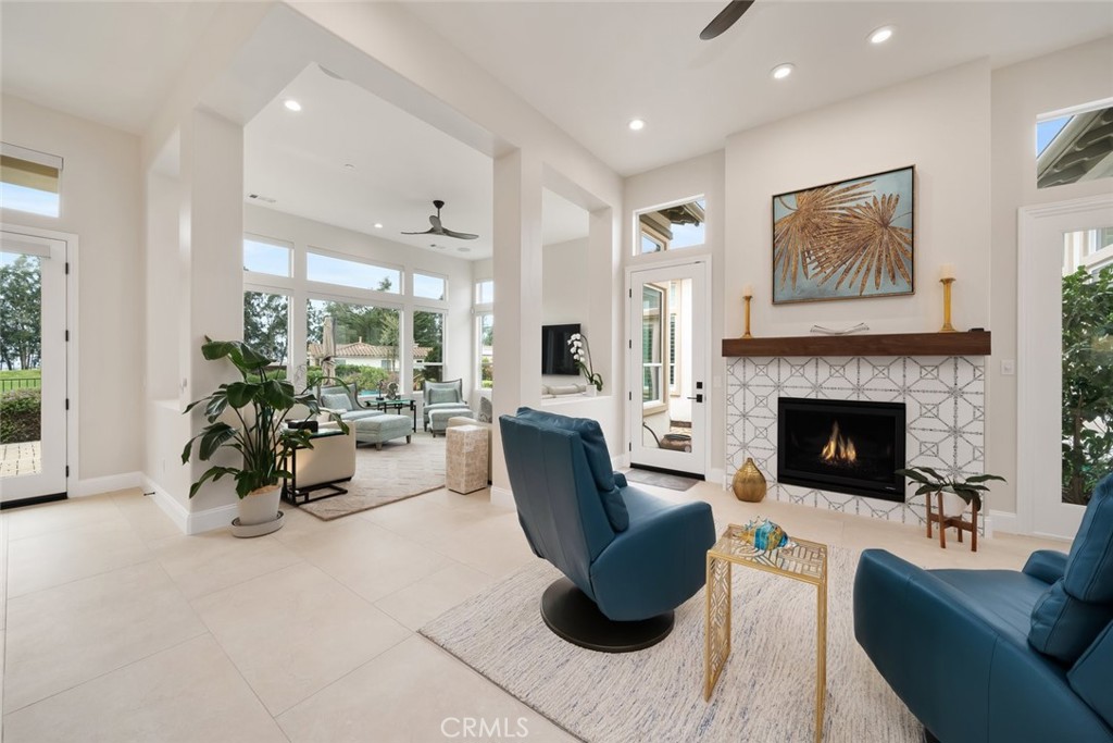 1988 Eucalyptus Road Nipomo, CA 93444 - Photo 18 of 63 a living room with furniture a fireplace and a potted plant