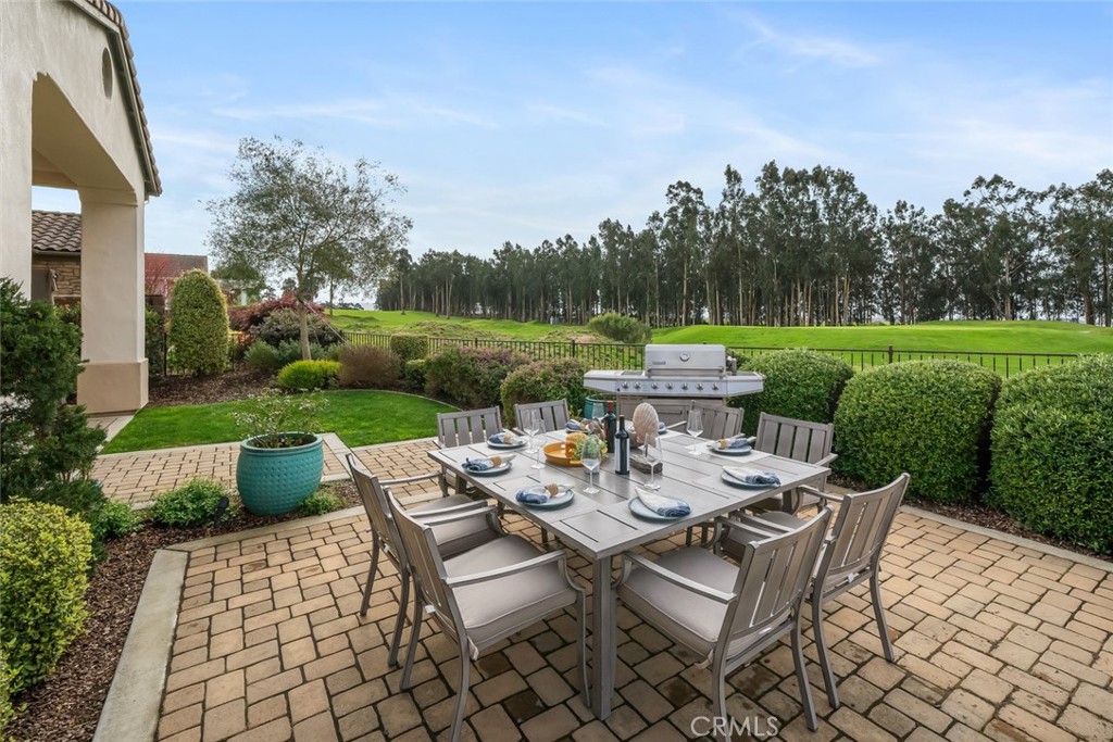 1988 Eucalyptus Road Nipomo, CA 93444 - Photo 21 of 63 a view of a patio with couches chairs and a table and chairs with garden