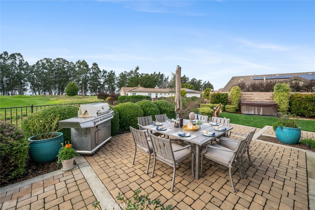 1988 Eucalyptus Road Nipomo, CA 93444 - Photo 22 of 63 a view of a patio with a dining table and chairs with a garden