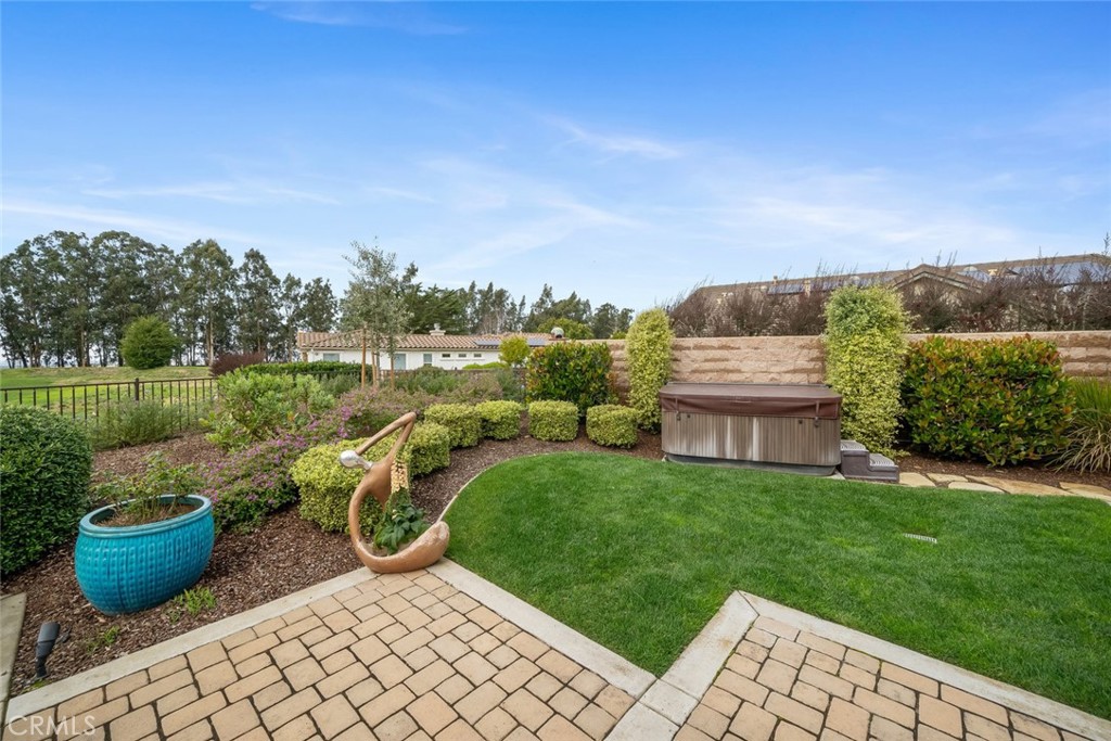 1988 Eucalyptus Road Nipomo, CA 93444 - Photo 23 of 63 a view of a backyard with potted plants and a garden