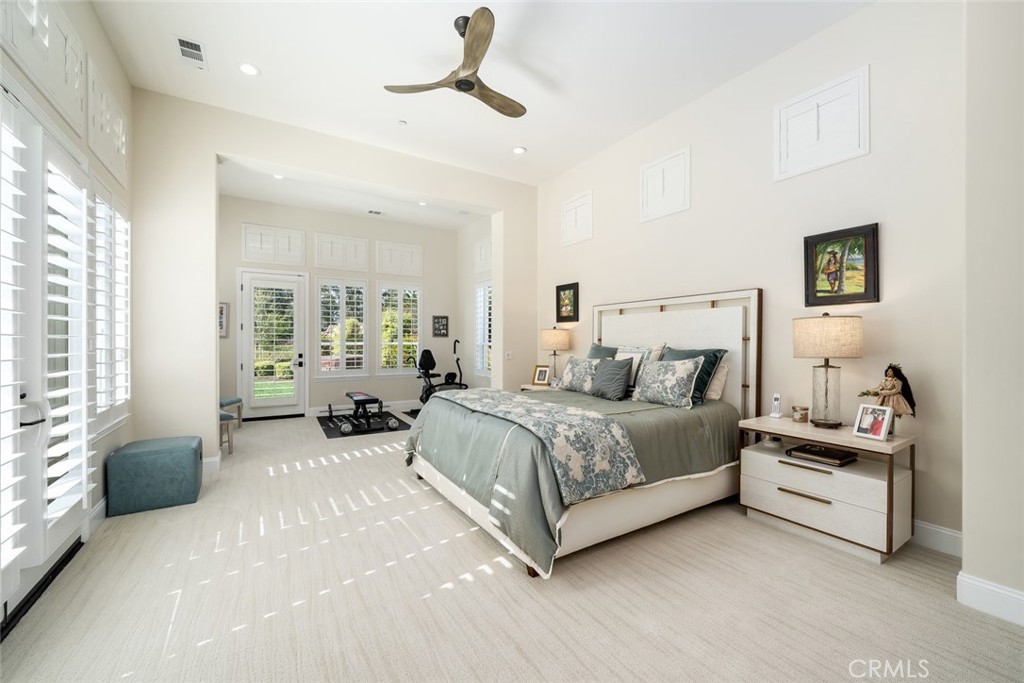 1988 Eucalyptus Road Nipomo, CA 93444 - Photo 30 of 63 a spacious bedroom with a bed a couch and a window