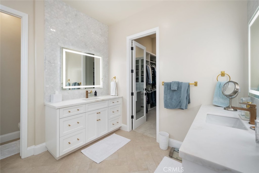 1988 Eucalyptus Road Nipomo, CA 93444 - Photo 34 of 63 a bathroom with a tub sink and mirror