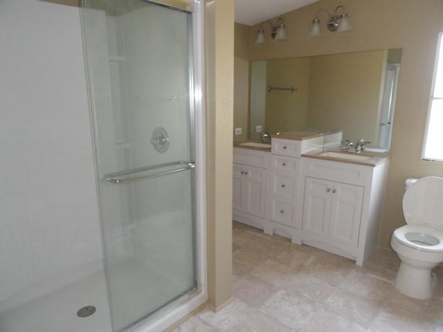 1512 McCauley Road Baker, FL 32531 - Photo 11 of 18 a spacious bathroom with a shower sink and mirror