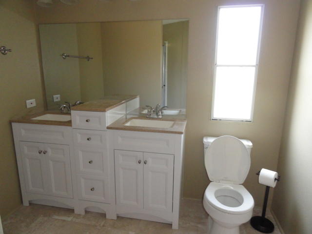 1512 McCauley Road Baker, FL 32531 - Photo 12 of 18 a bathroom with a toilet sink and mirror