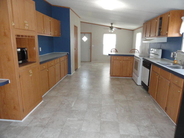 1512 McCauley Road Baker, FL 32531 - Photo 4 of 18 a large kitchen with cabinets and stainless steel appliances