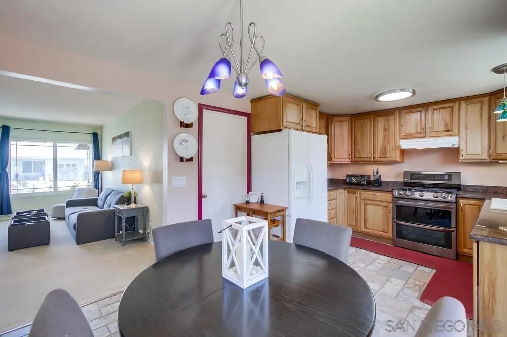 13409 Utopia Road Poway, CA 92064 - Photo 20 of 37 a living room with stainless steel appliances kitchen island granite countertop furniture a dining table and chairs