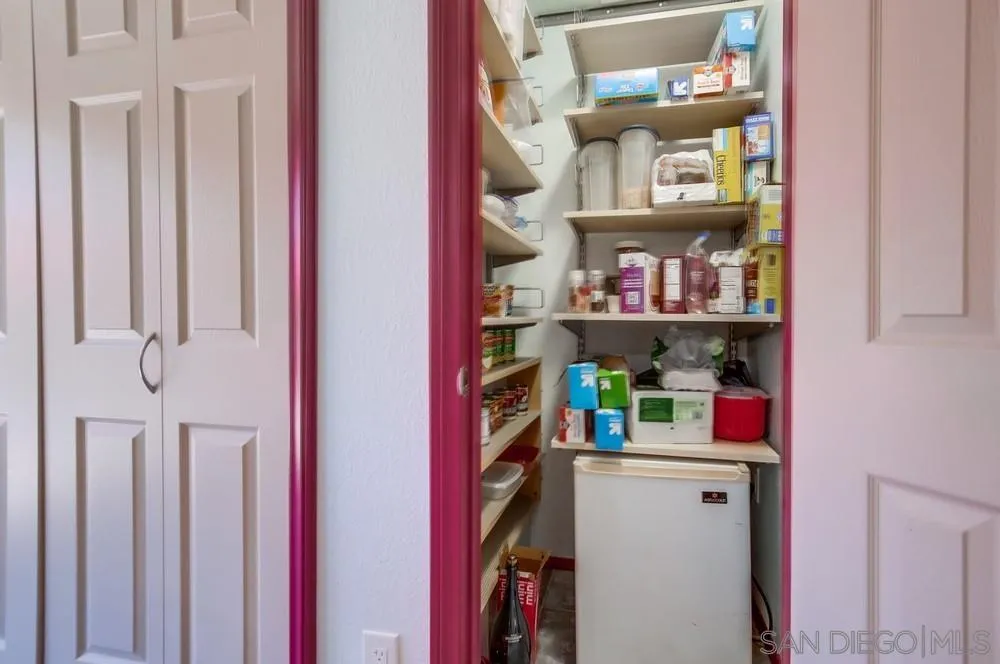 13409 Utopia Road Poway, CA 92064 - Photo 24 of 37 a view of walk in closet with clothes and shoes