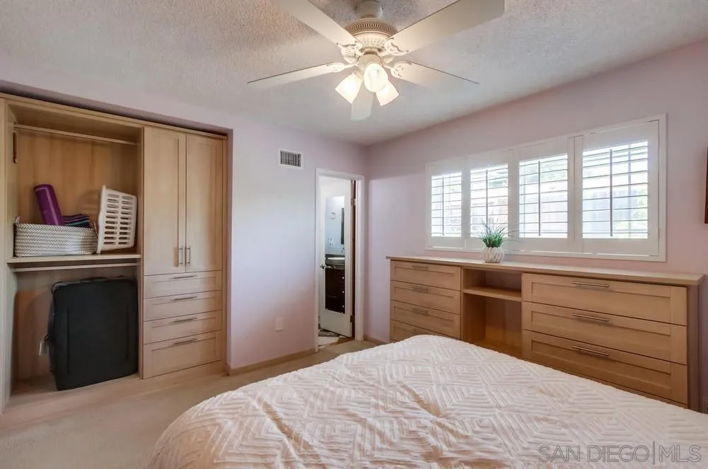 13409 Utopia Road Poway, CA 92064 - Photo 31 of 37 a bedroom with a bed and a dresser