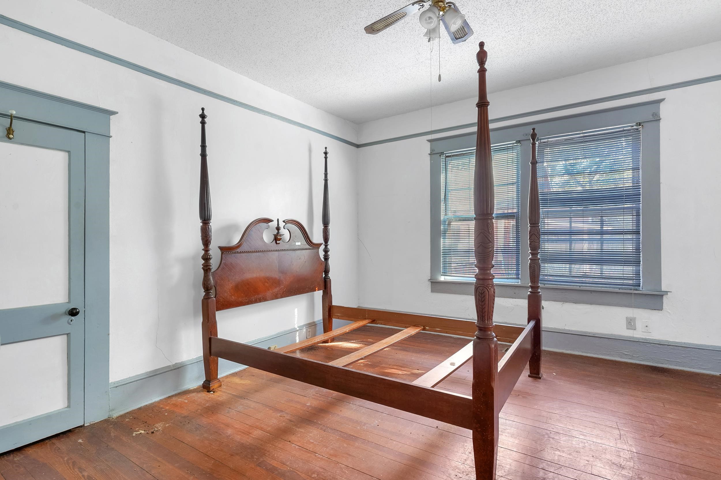 134 Washington Street St. Augustine, FL 32084 - Photo 14 of 41 Bedroom featuring a textured ceiling, hardwood / wood-style flooring, and a ceiling fan