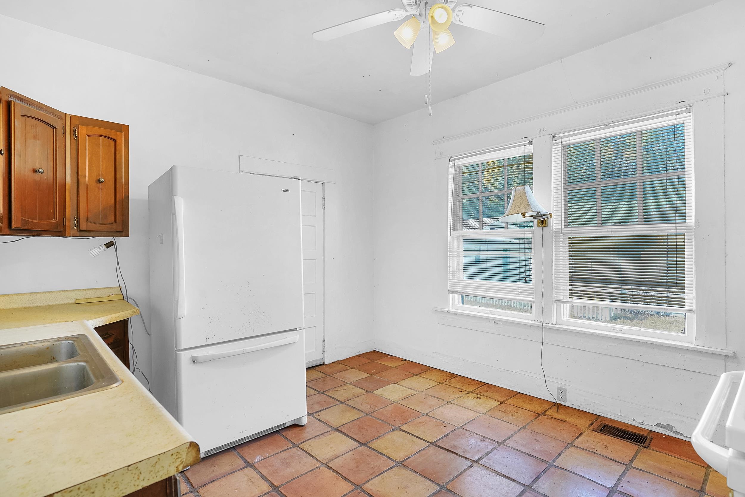 134 Washington Street St. Augustine, FL 32084 - Photo 19 of 41 a kitchen with a refrigerator and a sink