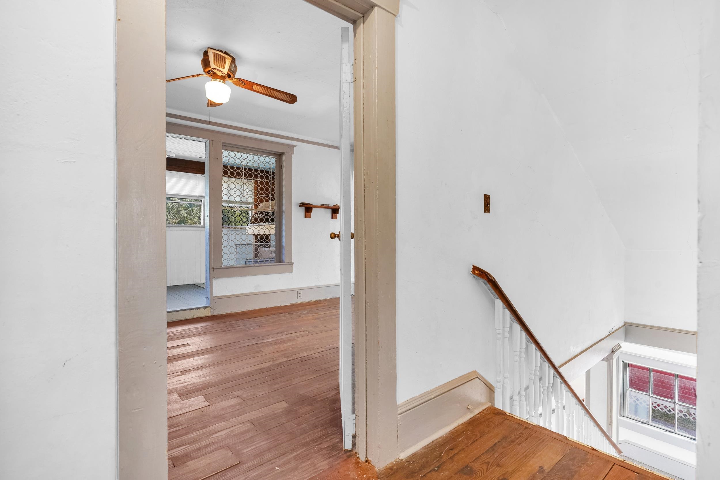 134 Washington Street St. Augustine, FL 32084 - Photo 19 of 41 Hallway featuring an upstairs landing and wood-type flooring