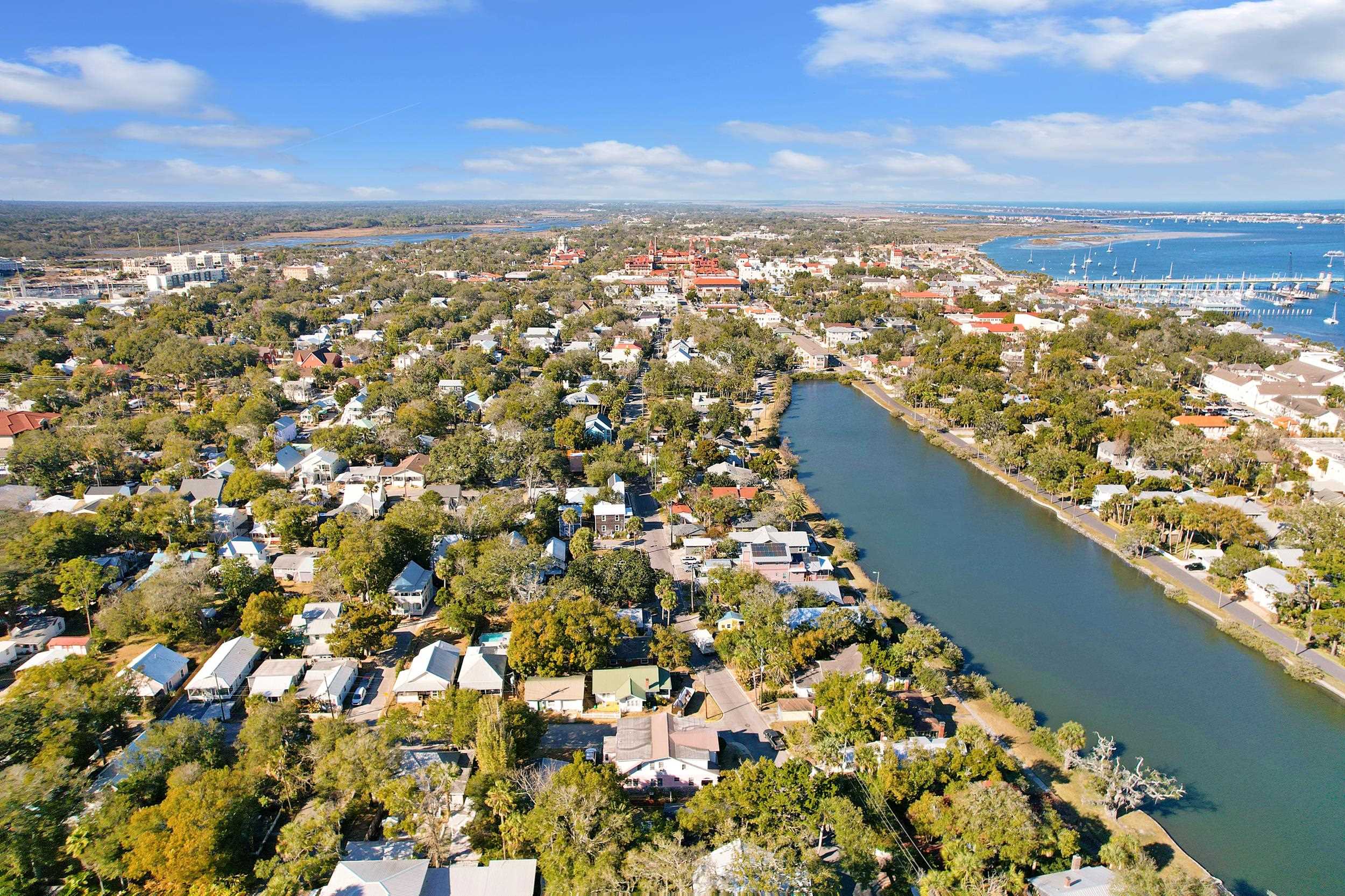 134 Washington Street St. Augustine, FL 32084 - Photo 2 of 41 Aerial view of residential area with a large body of water