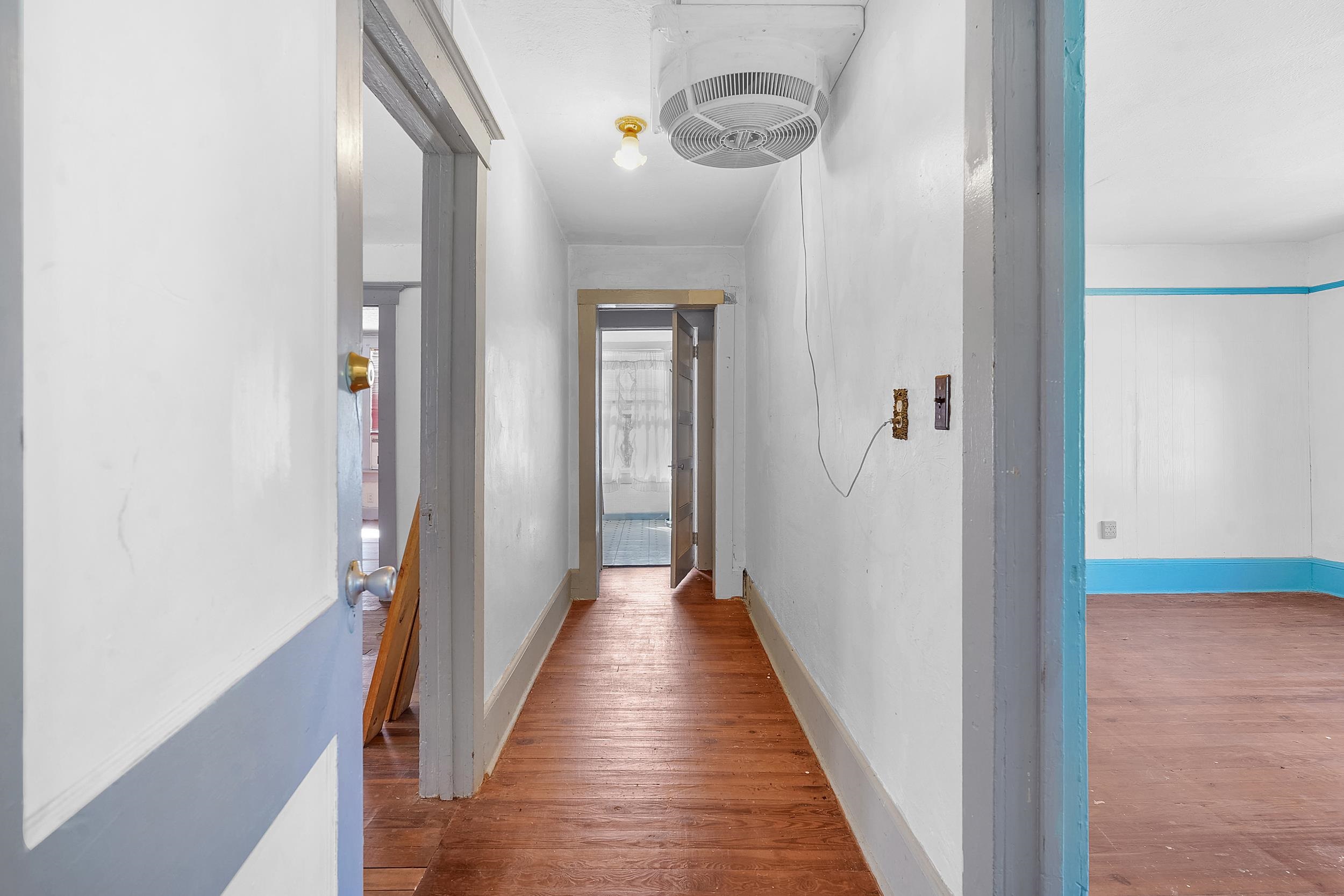 134 Washington Street St. Augustine, FL 32084 - Photo 23 of 41 Corridor with wood finished floors and baseboards