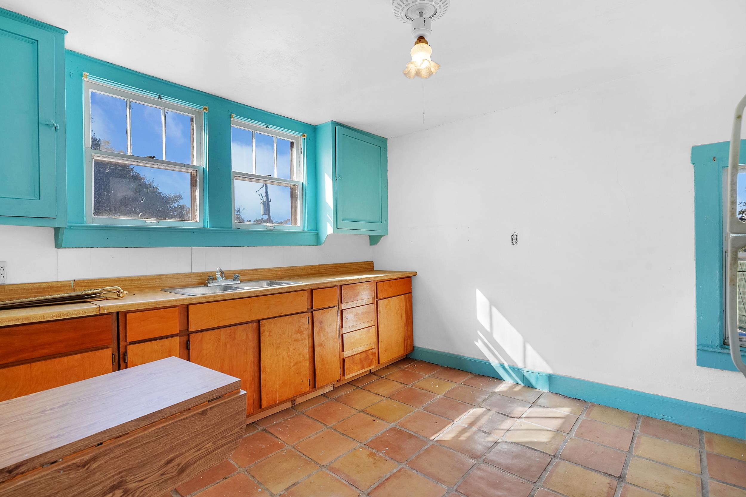 134 Washington Street St. Augustine, FL 32084 - Photo 28 of 41 Kitchen featuring light countertops and baseboards