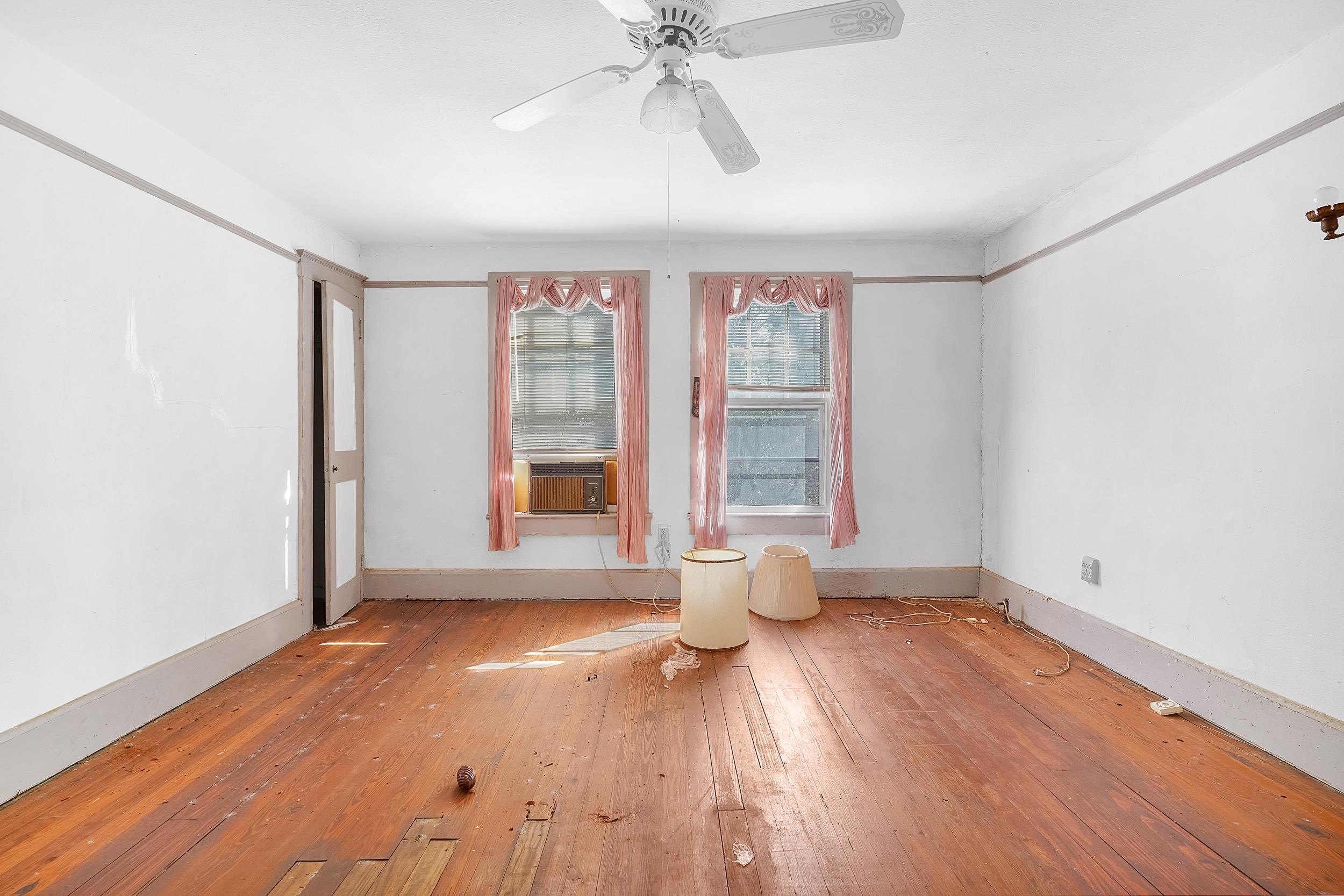 134 Washington Street St. Augustine, FL 32084 - Photo 31 of 41 Empty room featuring wood-type flooring and ceiling fan
