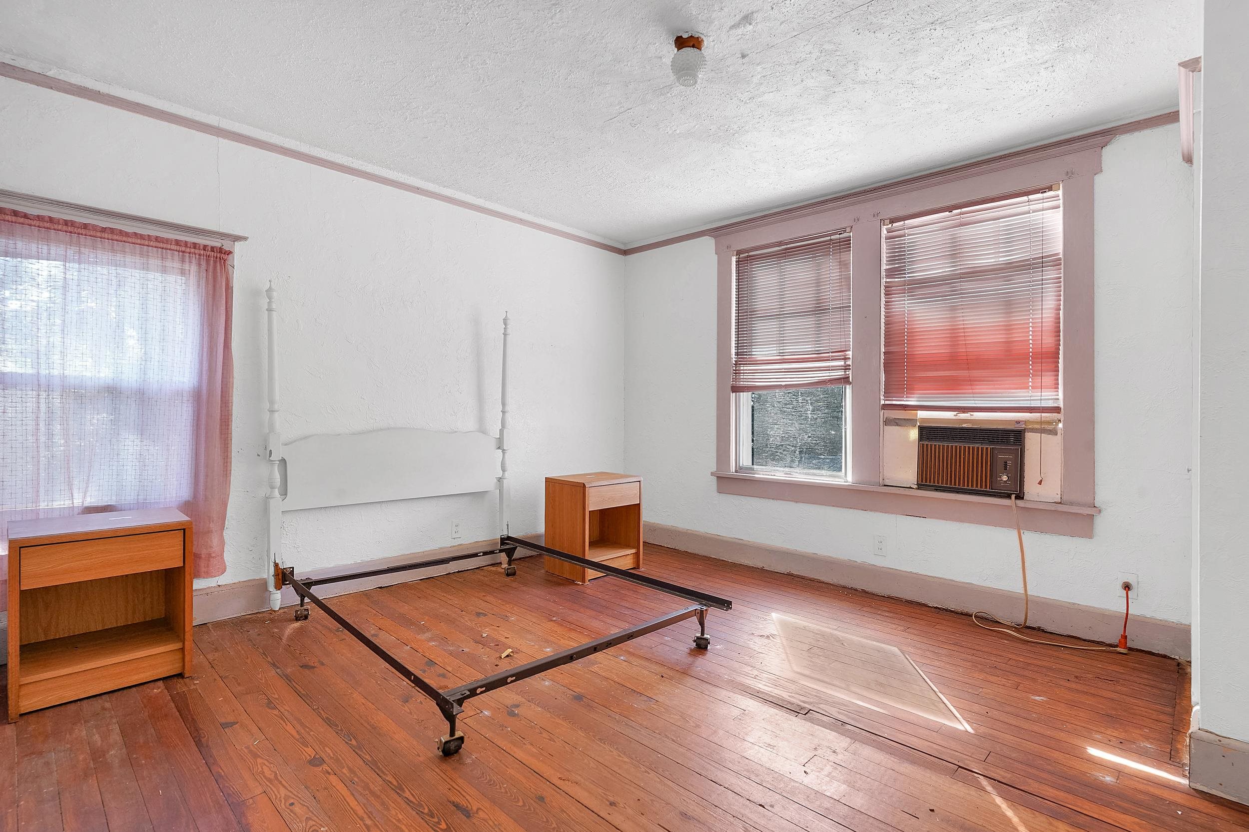 134 Washington Street St. Augustine, FL 32084 - Photo 32 of 41 Sitting room featuring wood-type flooring, a textured ceiling, ornamental molding, and cooling unit