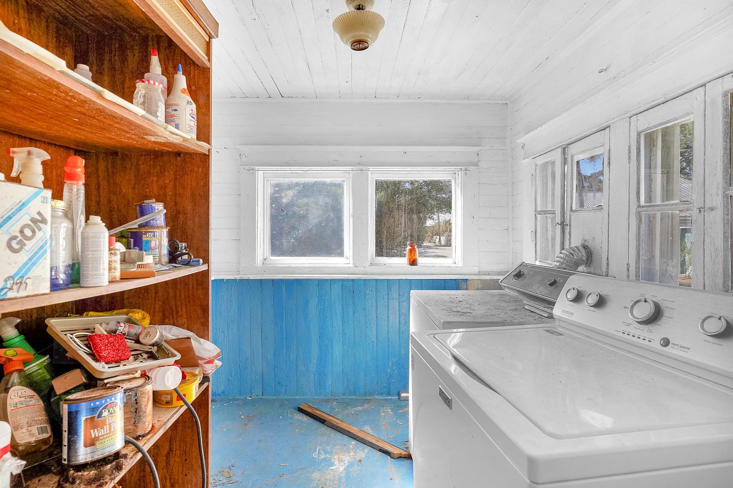 134 Washington Street St. Augustine, FL 32084 - Photo 35 of 41 Laundry area featuring wooden ceiling, wooden walls, concrete floors, and washer and clothes dryer