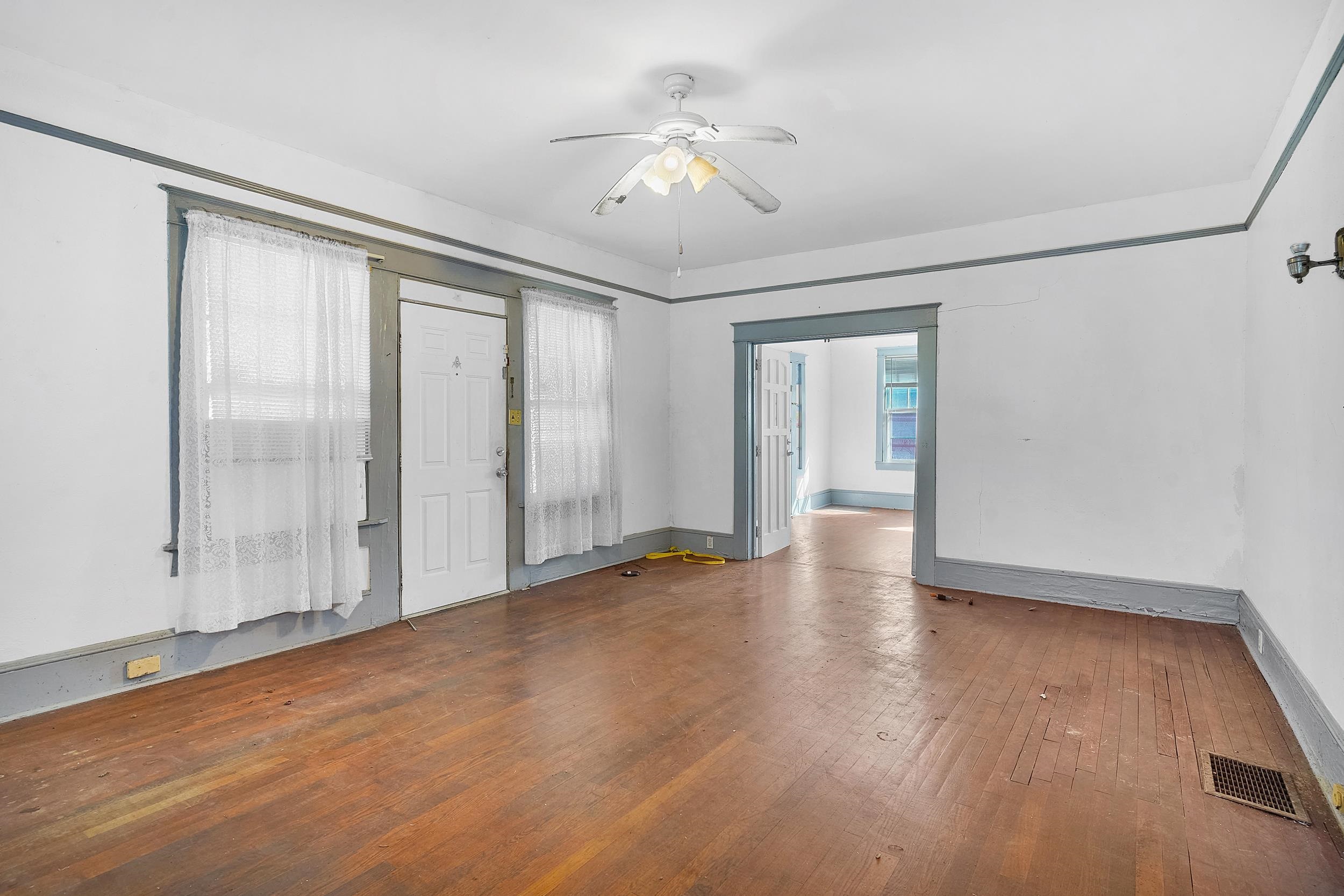 134 Washington Street St. Augustine, FL 32084 - Photo 9 of 41 Empty room with a ceiling fan and hardwood / wood-style flooring