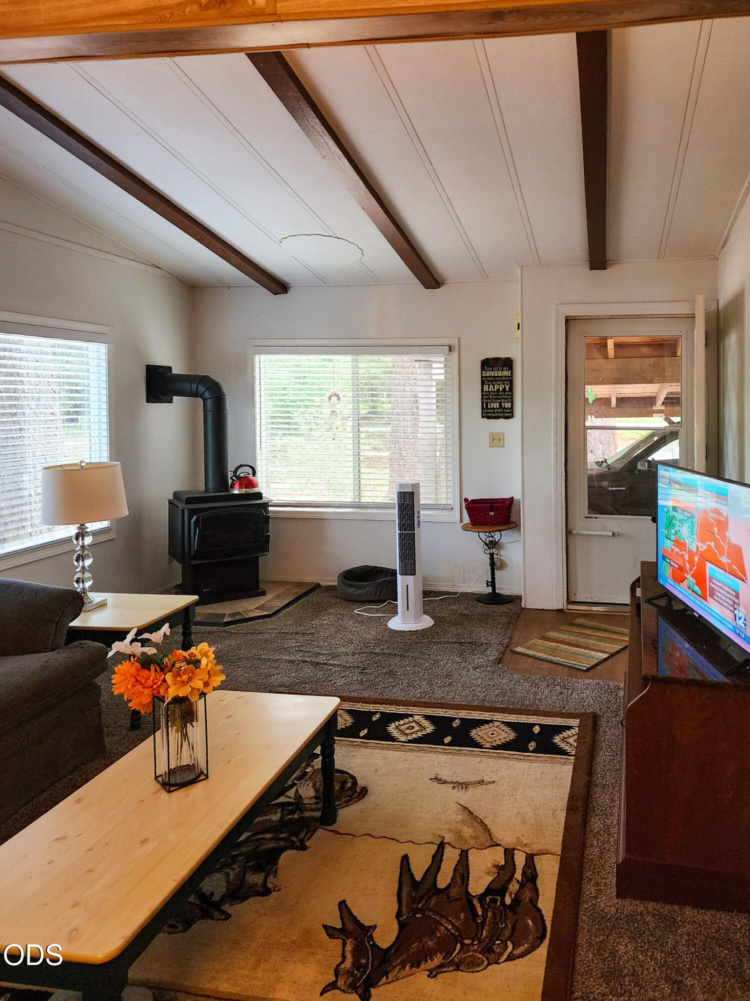 350 Hamilton Avenue Cave Junction, OR 97523 - Photo 3 of 34 a room with furniture and a flat screen tv