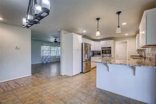 a view of a kitchen and dining room