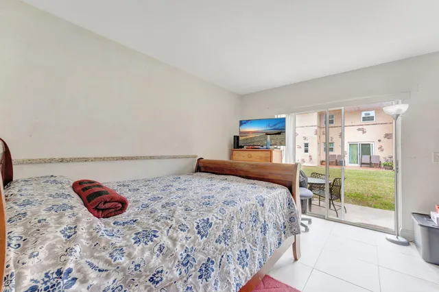 a bedroom with a bed and a table