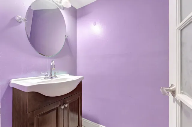 a bathroom with a sink and a mirror