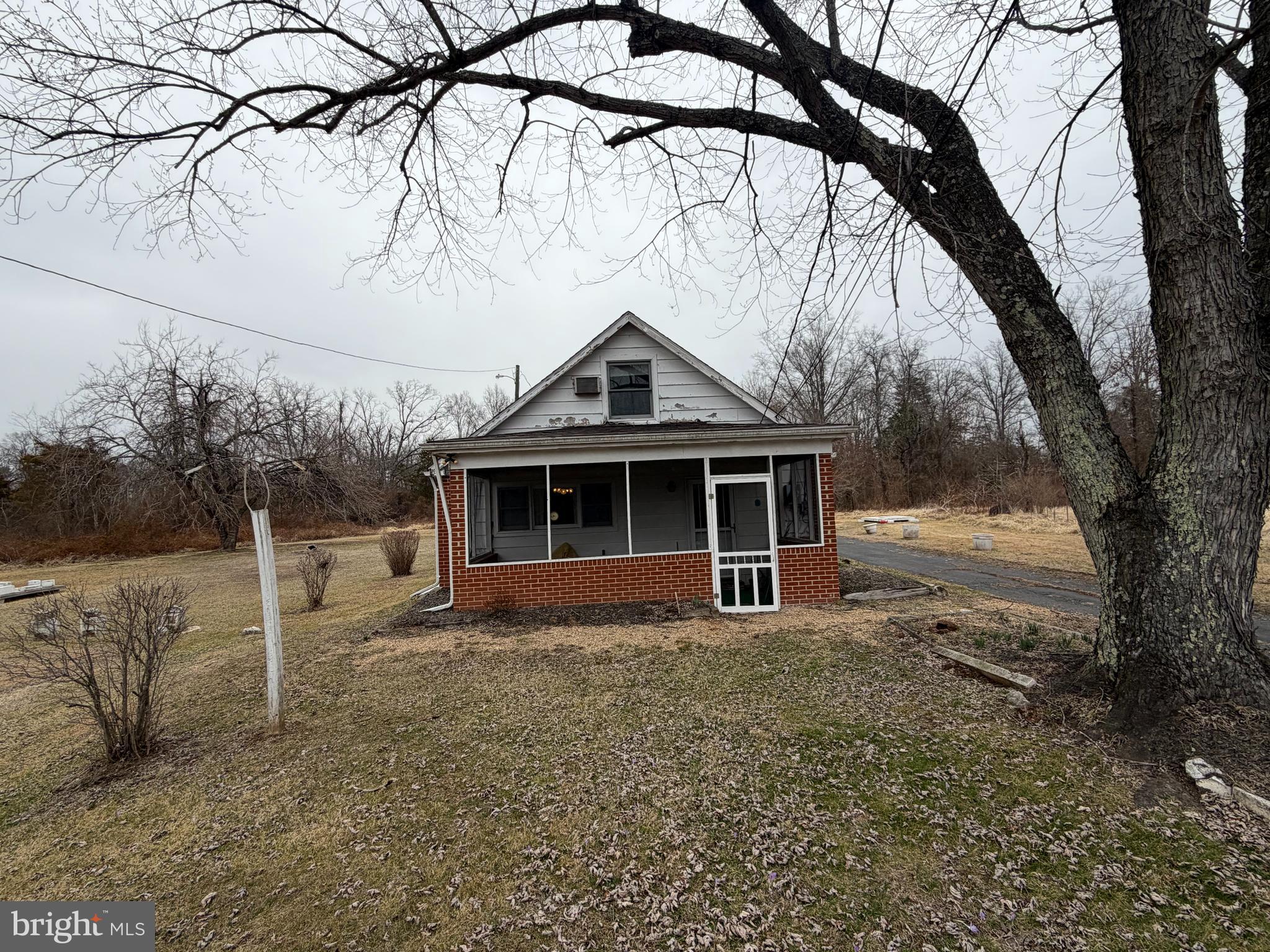 9163 Old Dumfries Road Catlett, VA 20119 - Photo 3 of 8 a front view of a house with a yard
