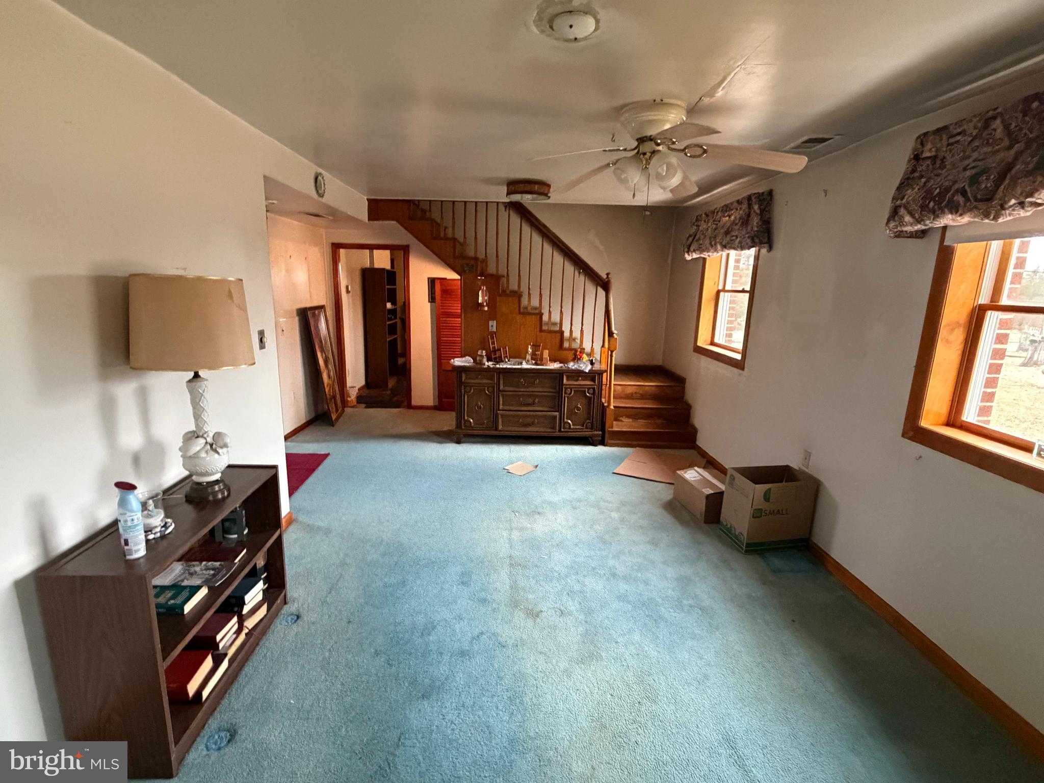 9163 Old Dumfries Road Catlett, VA 20119 - Photo 5 of 8 a view of a livingroom with furniture and a ceiling fan