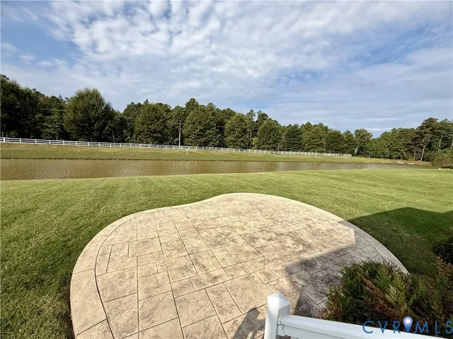 a view of a golf course with a lake view