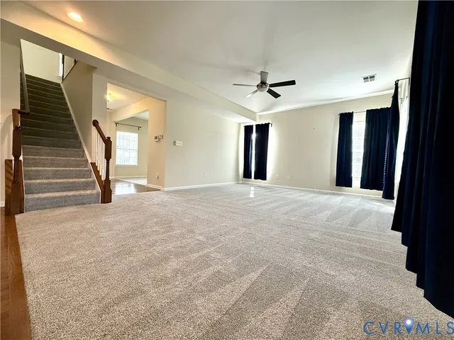 a view of a livingroom with a staircase