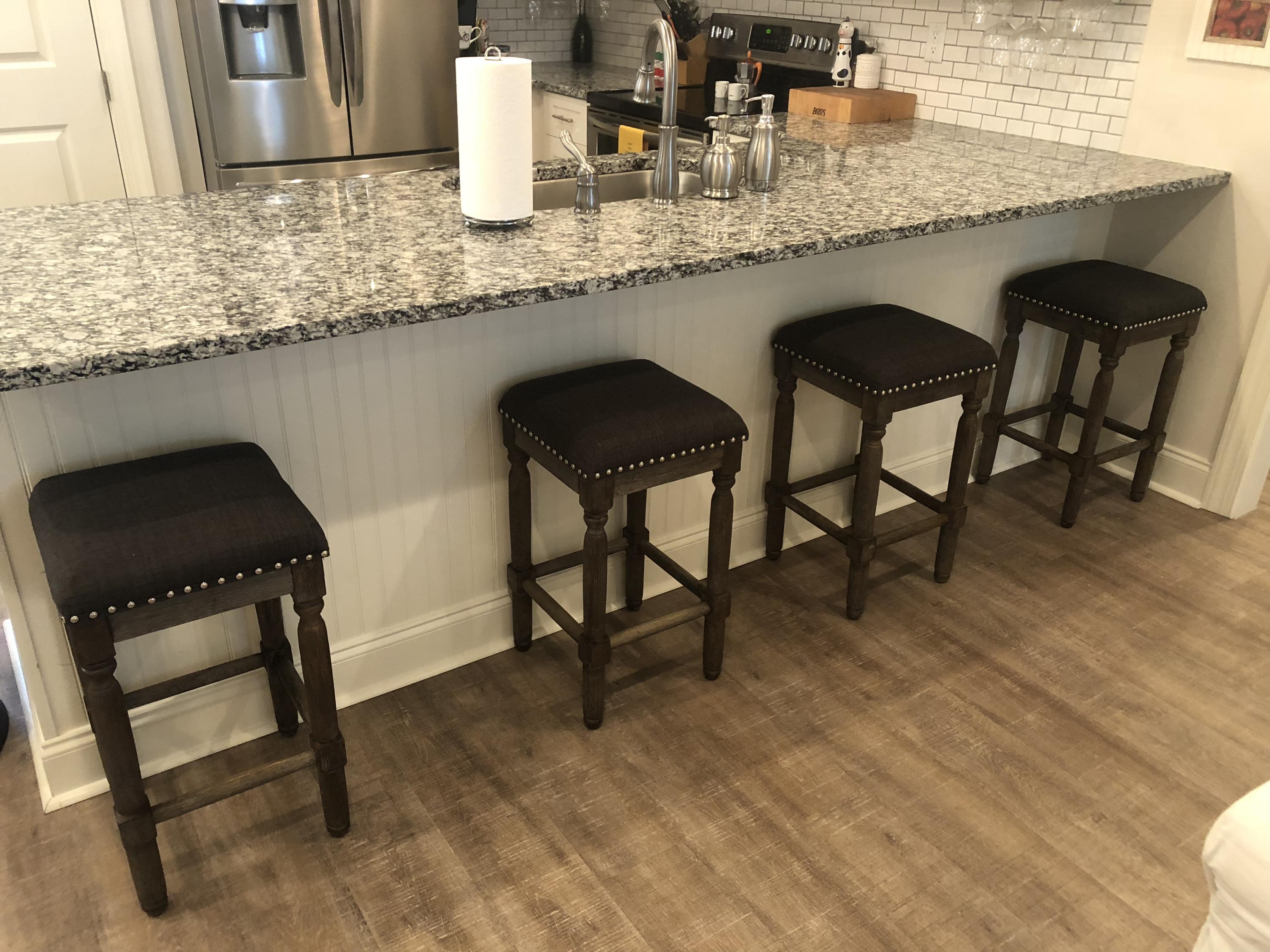 22 North Zander Way Santa Rosa Beach, FL 32459 - Photo 7 of 38 a kitchen with granite countertop sink table and chairs