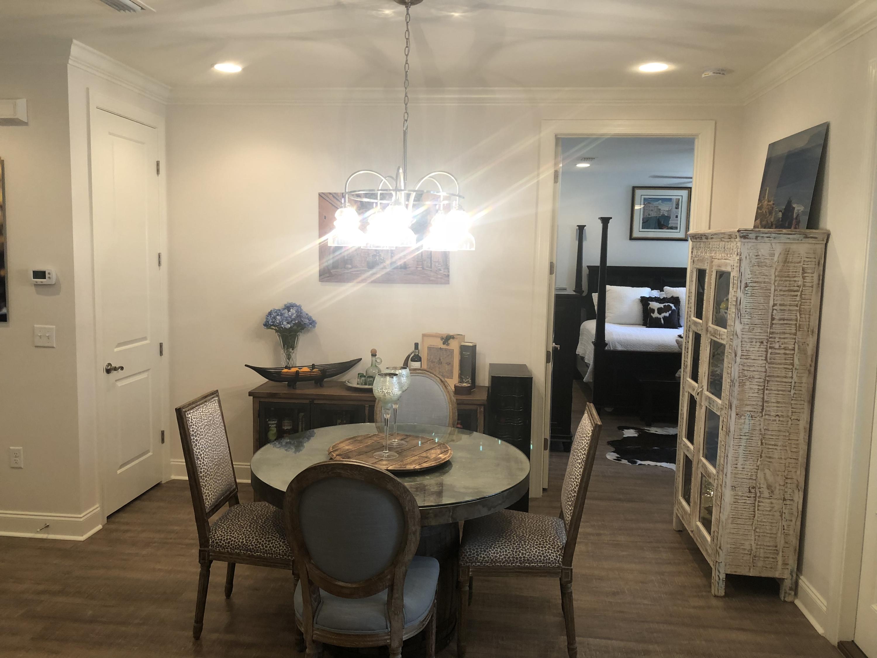 22 North Zander Way Santa Rosa Beach, FL 32459 - Photo 8 of 38 a view of a dining room with furniture and wooden floor