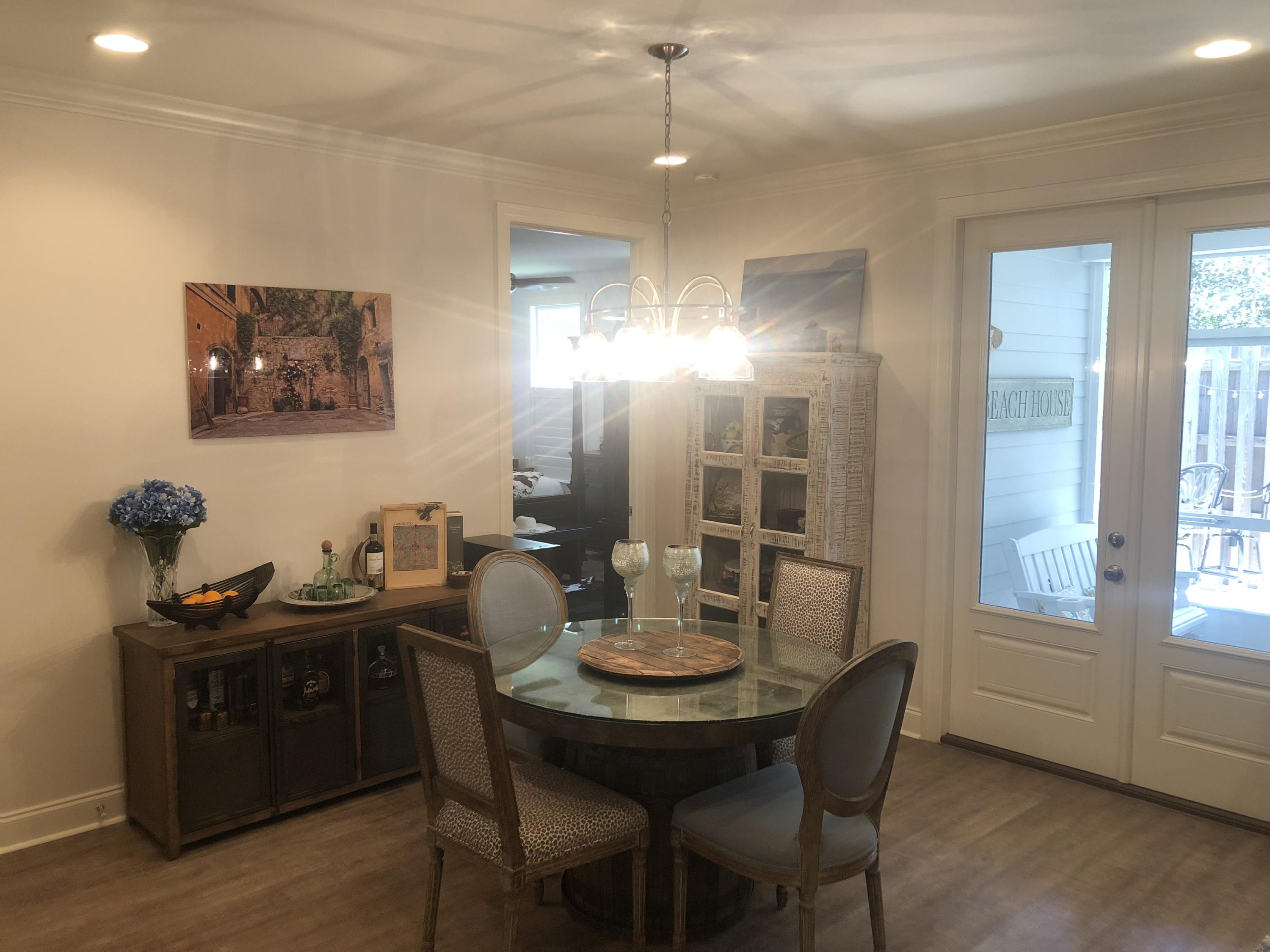22 North Zander Way Santa Rosa Beach, FL 32459 - Photo 9 of 38 a view of a dining room with furniture and wooden floor