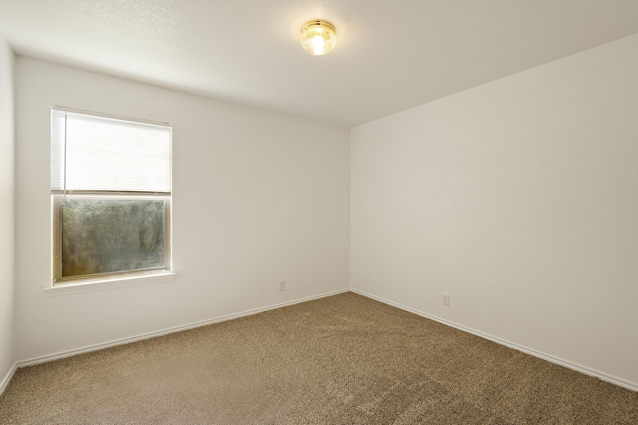 200 Lexington Kyle, TX 78640 - Photo 20 of 25 Carpeted empty room featuring baseboards