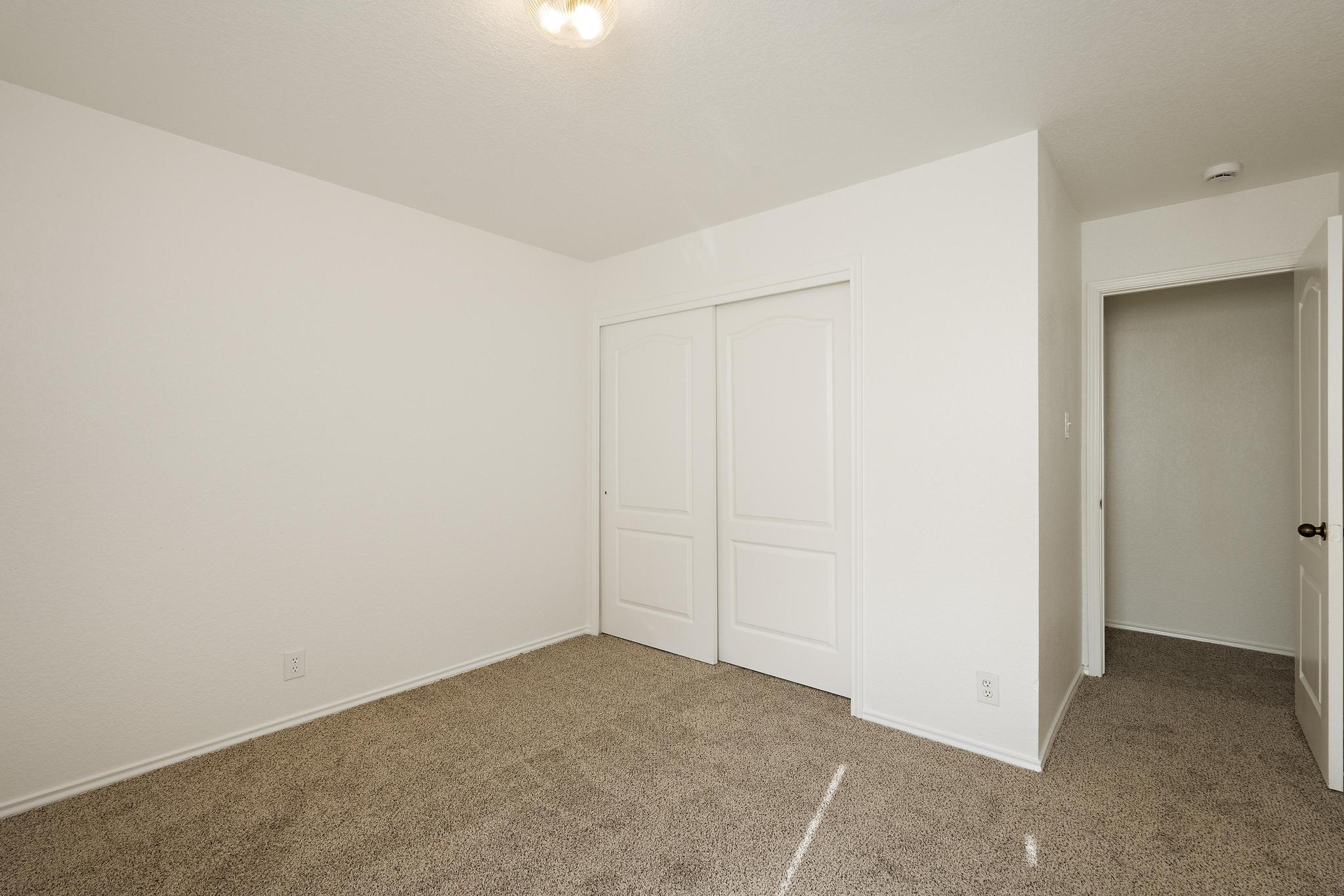 200 Lexington Kyle, TX 78640 - Photo 21 of 25 Unfurnished bedroom featuring carpet flooring and a closet