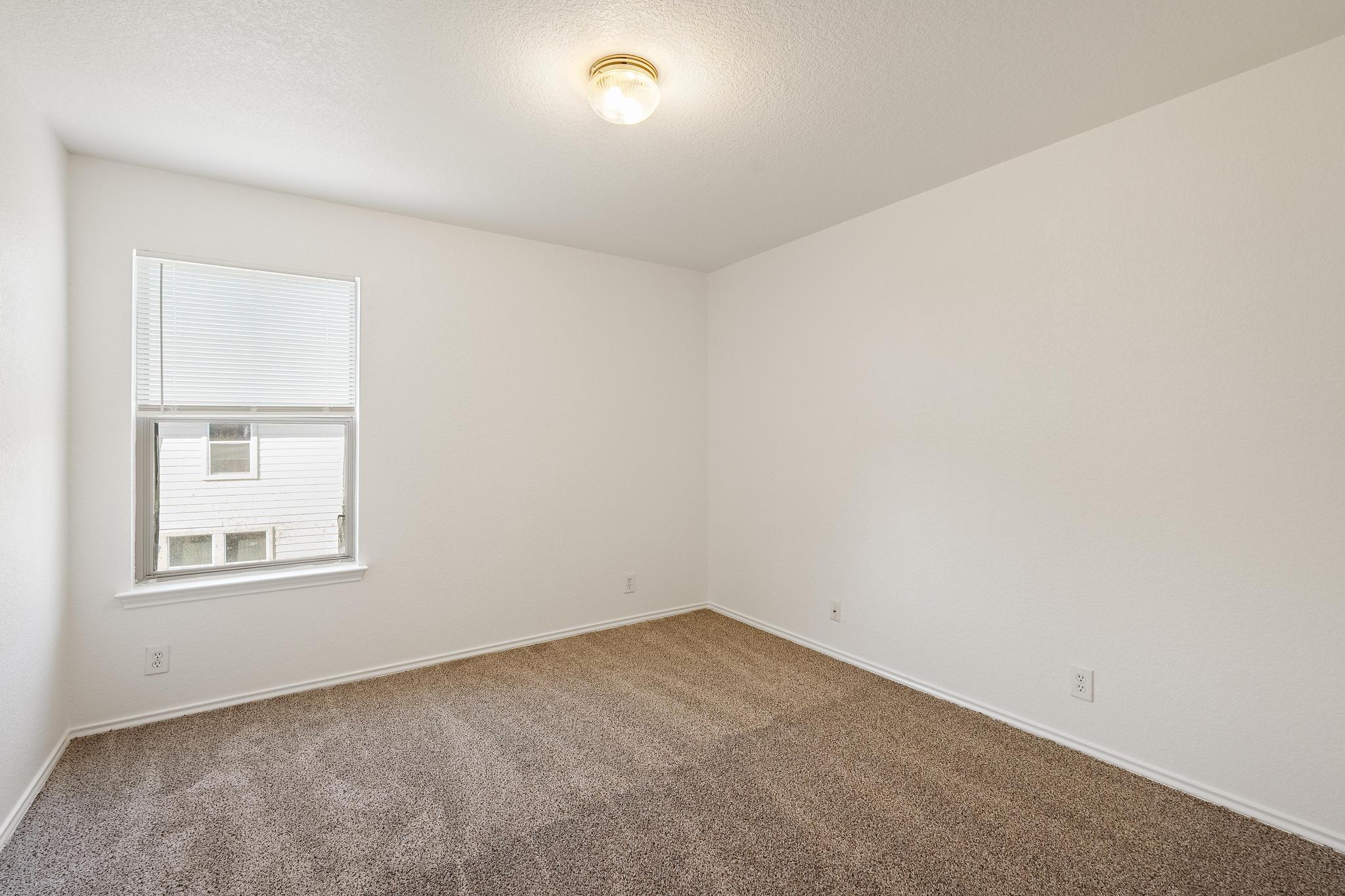 200 Lexington Kyle, TX 78640 - Photo 23 of 25 Spare room with carpet flooring and a textured ceiling