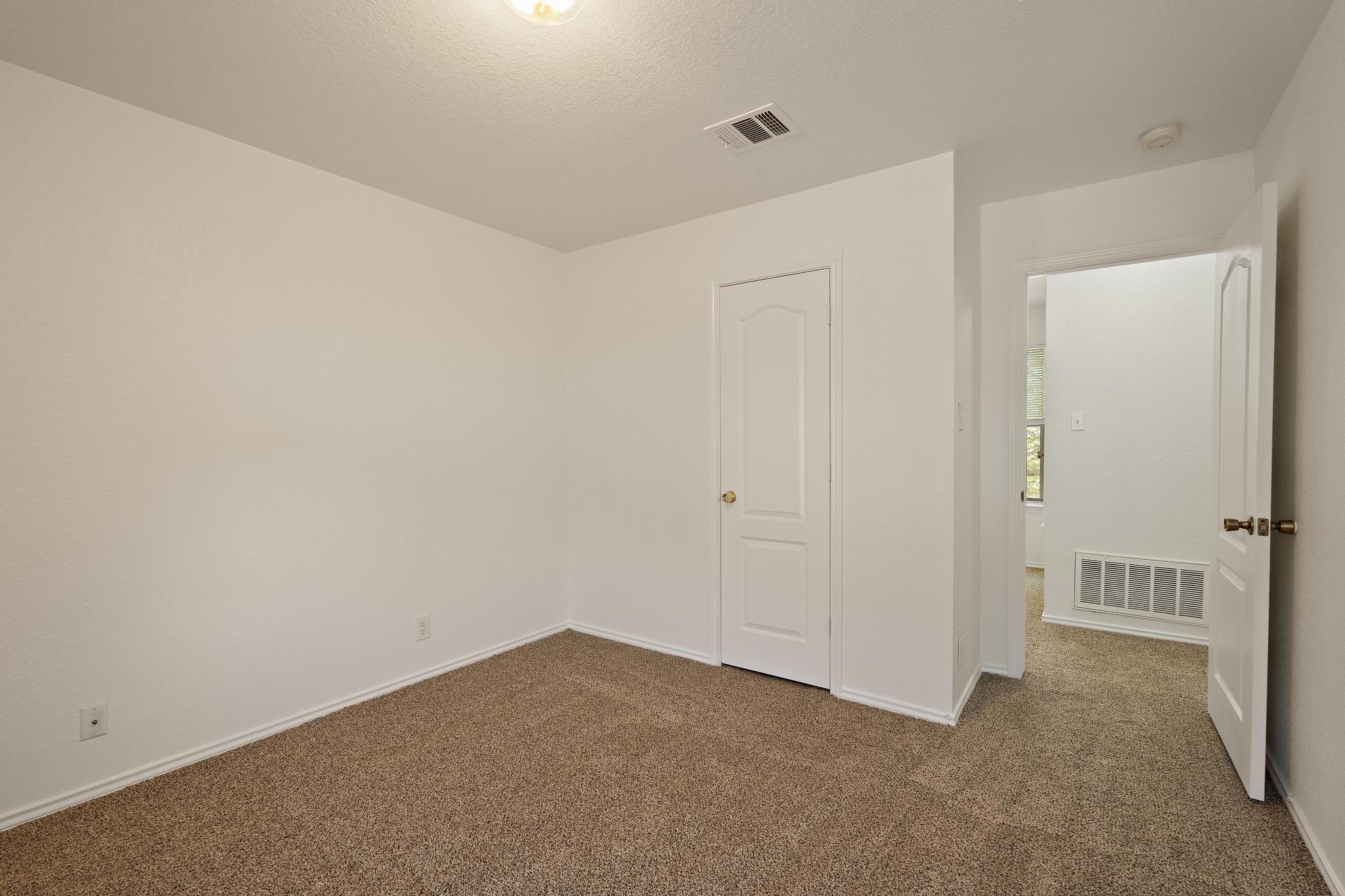 200 Lexington Kyle, TX 78640 - Photo 24 of 25 Unfurnished bedroom with carpet and a textured ceiling