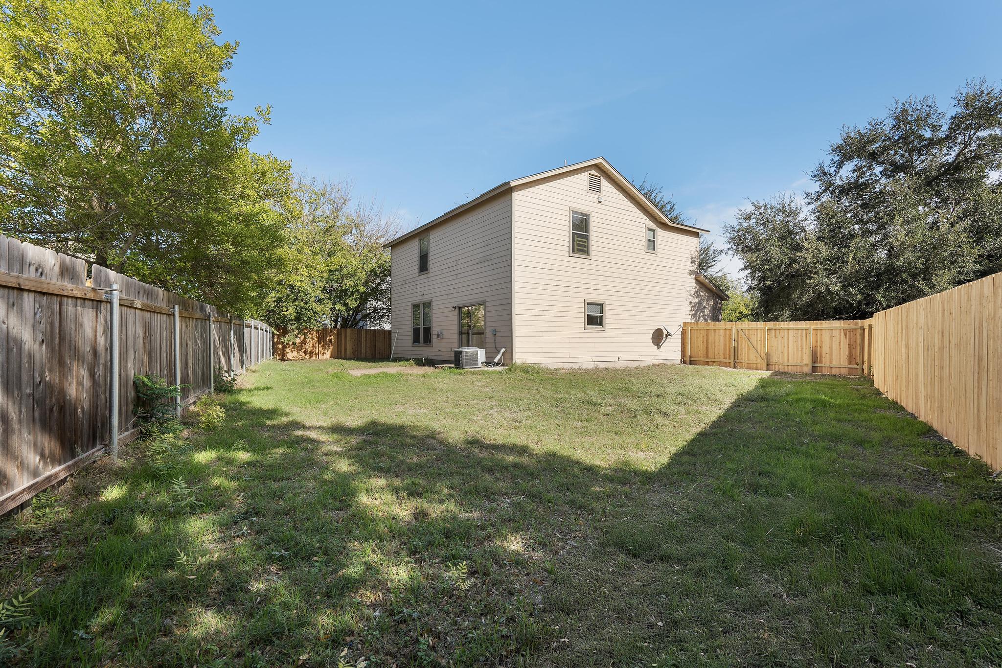 200 Lexington Kyle, TX 78640 - Photo 25 of 25 Rear view of house featuring a fenced backyard