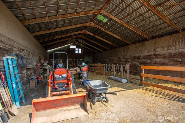 a view of a chairs and table in patio