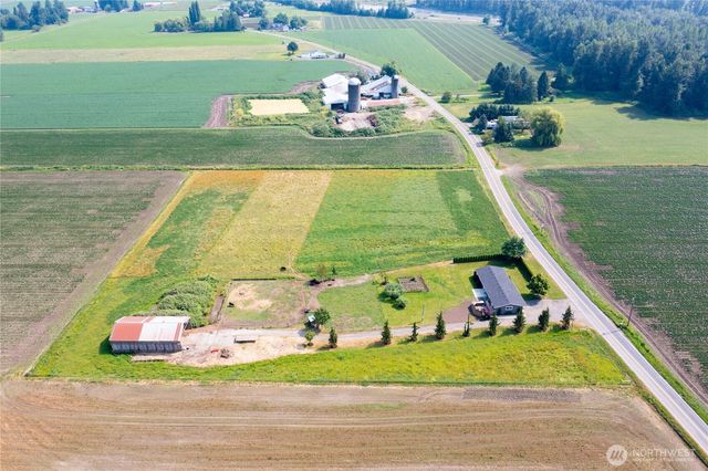 a view of a pool with a yard