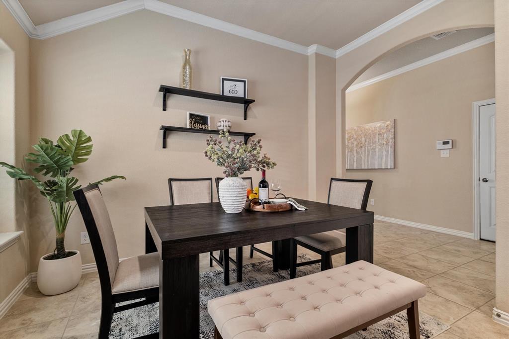 2413 Austin Lane Prosper, TX 75078 - Photo 6 of 32 a view of a dining room with furniture and wooden floor