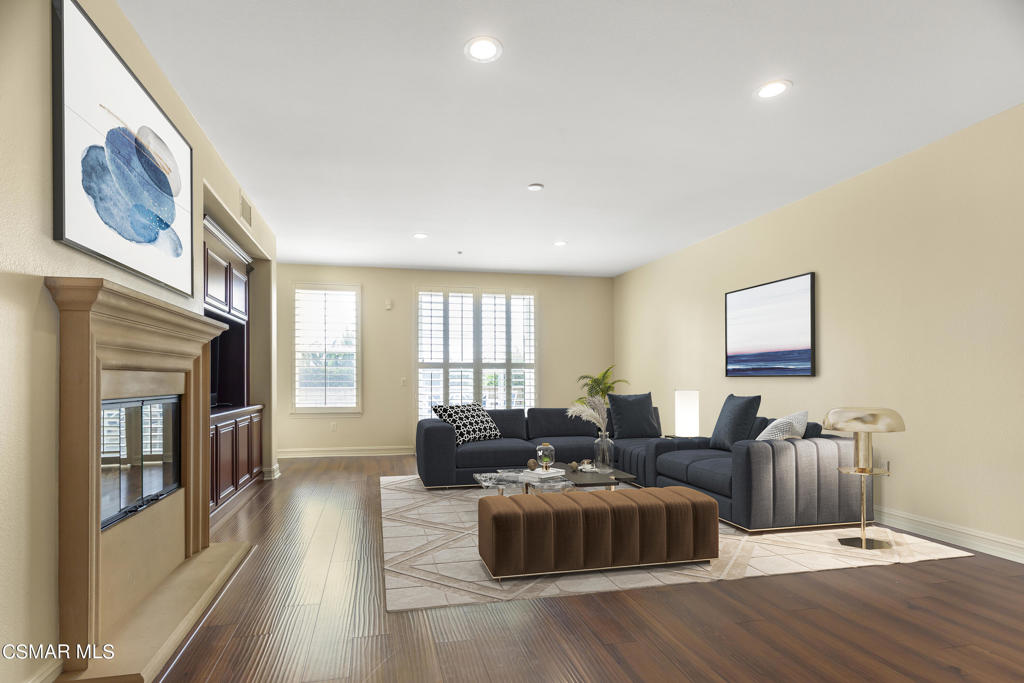 1415 Windshore Way Oxnard, CA 93035 - Photo 24 of 61 a living room with furniture and a flat screen tv