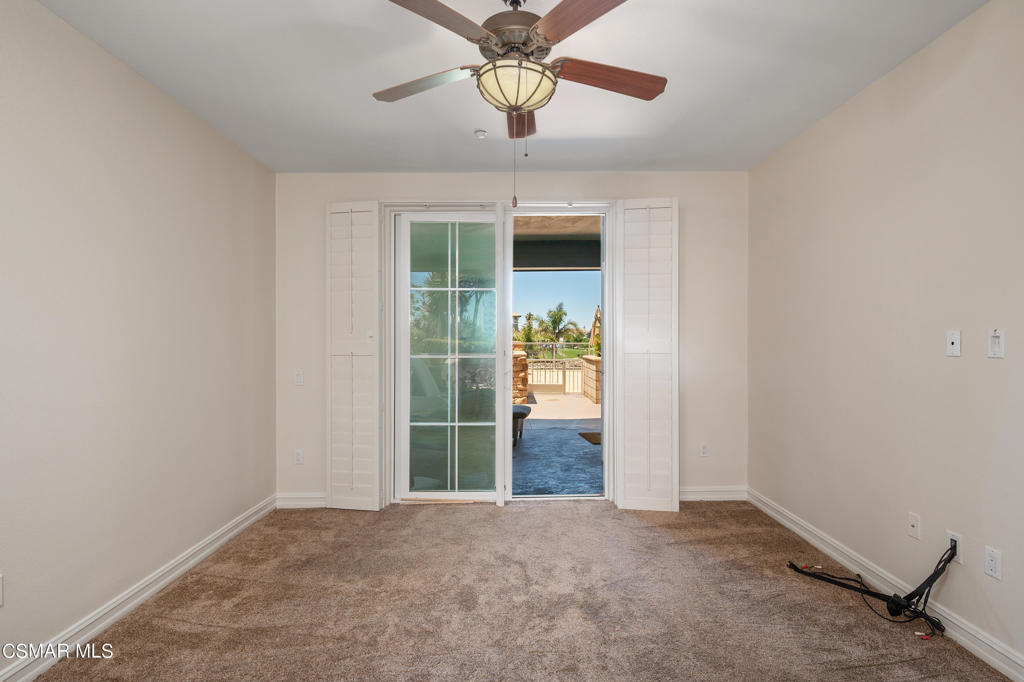 1415 Windshore Way Oxnard, CA 93035 - Photo 33 of 61 a view of a room with a ceiling fan and a window