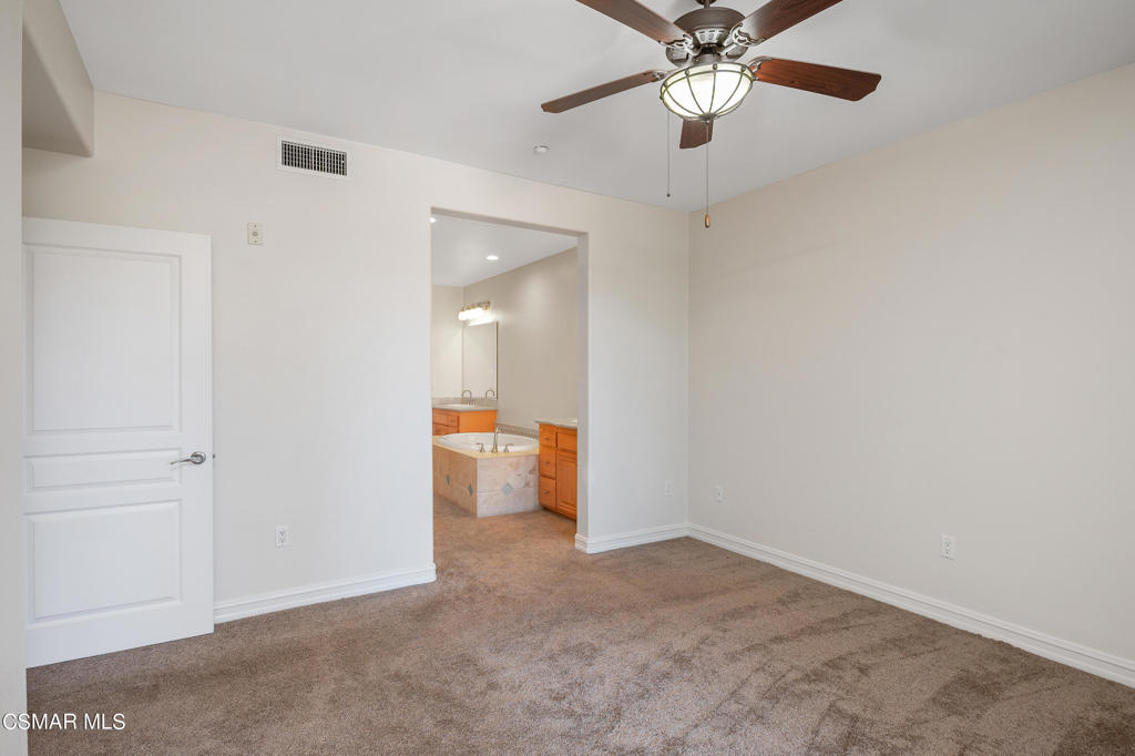 1415 Windshore Way Oxnard, CA 93035 - Photo 34 of 61 an empty room with closet and a chandelier fan