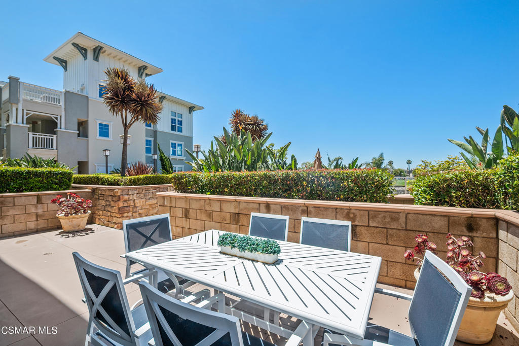 1415 Windshore Way Oxnard, CA 93035 - Photo 44 of 61 a view of a patio with table and chairs
