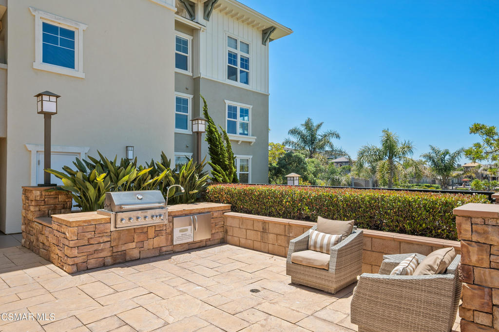 1415 Windshore Way Oxnard, CA 93035 - Photo 49 of 61 a view of a house with a couches in a patio