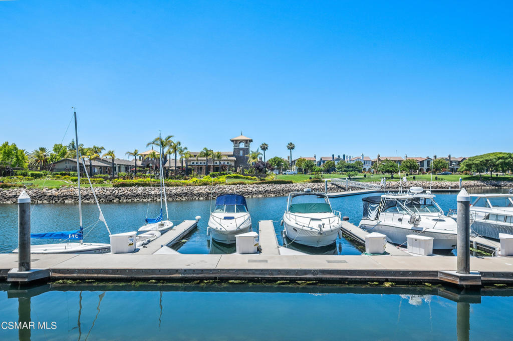 1415 Windshore Way Oxnard, CA 93035 - Photo 51 of 61 a view of a lake with a table and chairs