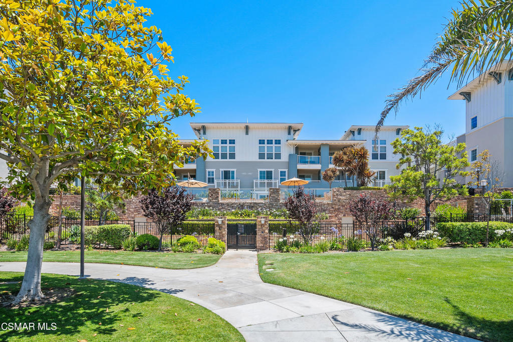 1415 Windshore Way Oxnard, CA 93035 - Photo 52 of 61 a view of a big building with a big yard and potted plants