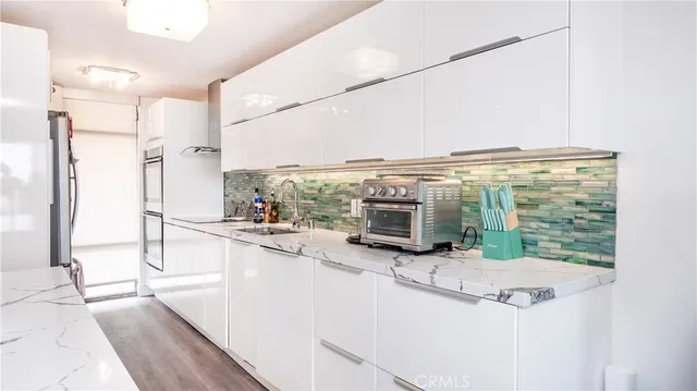 a bedroom with a bed and large window